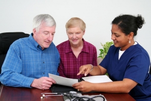 Image of health care professional counselling senior couple