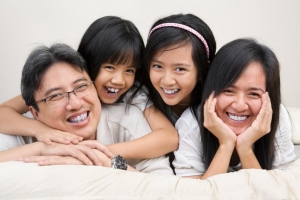 Image of family smiling