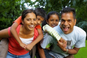 Image of family playing and smiling