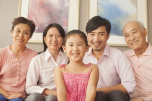 Image of child, parents and grandparents smiling