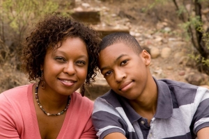 Image of mother and teenage son smiling
